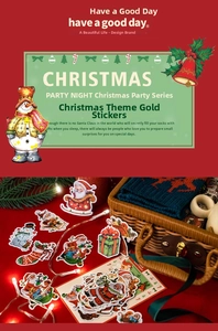 Macro detail of Christmas themed gold foil stickers with Santa and snowman patterns