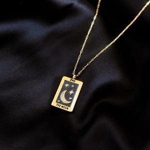 18K gold plated tarot moon necklace with black enamel inlay and sparkling crystals