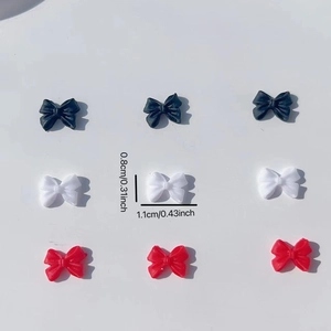 Matte resin bow nail charms in black white and red colors showing size 11mm dimensions