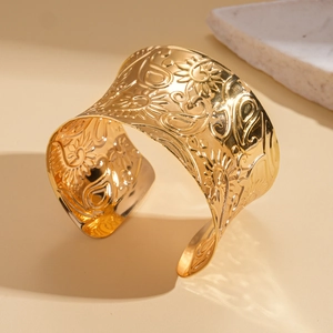 Chic gold-plated wide open cuff bracelet featuring intricate vintage floral embossing