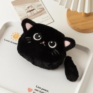 Close-up of fluffy black plush cat coin purse with embroidered details and soft tail charm