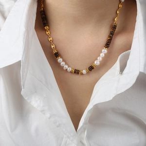 Handmade necklace with tiger eye stones, freshwater pearls, and gold-plated steel chain