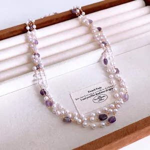 French style multilayer pearl and amethyst beaded necklace displayed on velvet tray