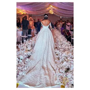 Elegant white lace wedding dress featuring a V-neck and a long luxury floral train