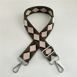 Detail of army green argyle jacquard strap with polished silver metal swivel hooks