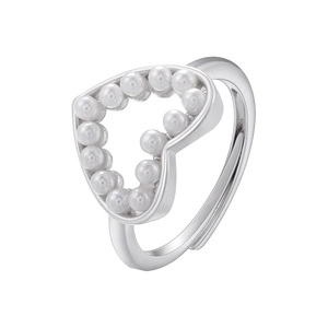 Detailed view of silver open ring with hollow heart design and faux pearl inlays