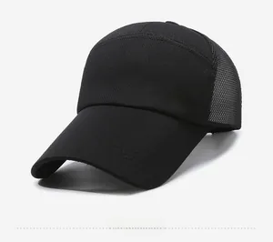 Detail view of the breathable honeycomb mesh and metallic shield emblem on this black baseball cap