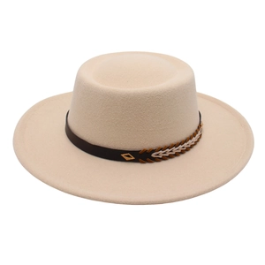 Detail of beige felt fedora featuring leather band with ethnic weaving and metal buckle