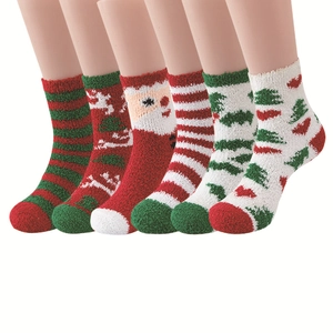 Detailed close-up of six fuzzy Christmas socks with colorful festive patterns on mannequins