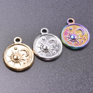 Macro shot of celestial sun and moon charms in gold, silver and rainbow finishes