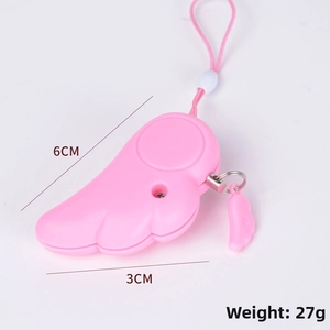 Detailed view of pink wing personal safety alarm measuring 6cm by 3cm and weighing 27g