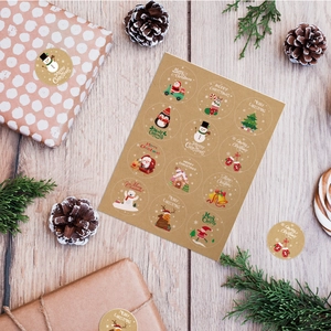 Flat lay of Merry Christmas kraft paper stickers with Santa and reindeer on wooden background