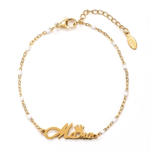 Detail of gold-plated stainless steel Mama bracelet with white beads and crown charm