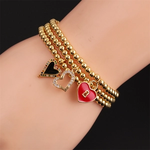 Three-layer gold beaded bracelet with colorful enamel heart charms and zircon inlays