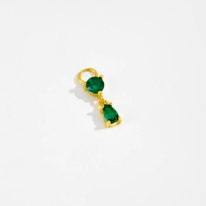 Close-up of golden S925 silver pendant featuring green round and teardrop gemstones