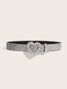 Close-up of silver glitter belt featuring a sparkling rhinestone heart buckle for women