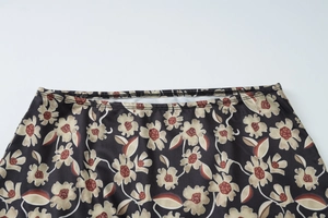 Close-up of elastic waistband and floral pattern on high waist slim-fit skirt