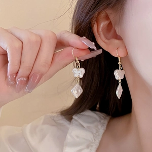 Elegant gold earrings featuring mother-of-pearl butterfly and geometric pendants for women