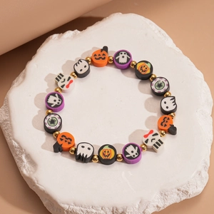 Detailed view of Halloween polymer clay bracelet with pumpkin, ghost and skull beads