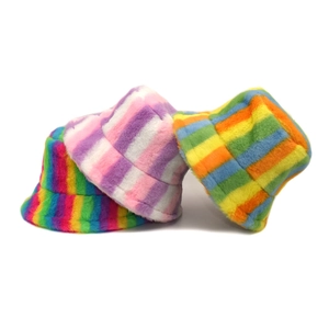 Plush rainbow striped bucket hats for women in various colorful faux fur patterns