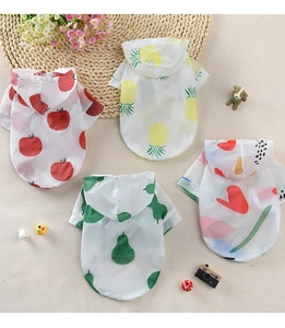 Flat lay of four colorful summer pet sun protection hoodies with fruit and abstract patterns