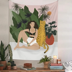 Detail of bohemian tapestry featuring a woman and leopard in a tropical jungle setting