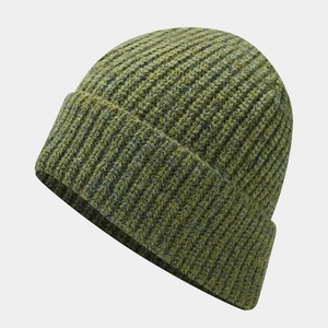 Close-up of grass green knit beanie showing thick ribbed texture and wide cuffed brim