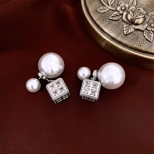 French style silver pin earrings with pearls and zircon square pendant on velvet