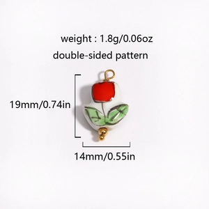 Detail view of 1.8g heart ceramic pendant with 18K gold plated clasp and floral pattern