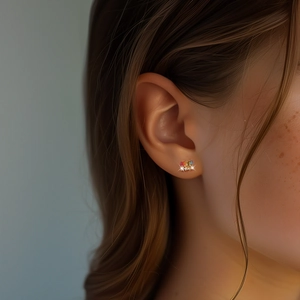 Close-up of S925 silver earrings with colorful square gems and pavé zircons on model