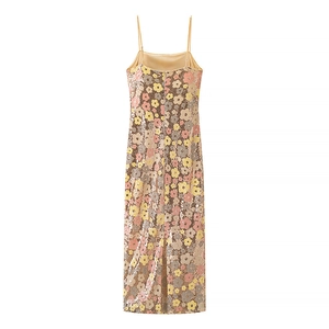 Detail showing back slit and floral sequin pattern on the slim-fit party maxi dress