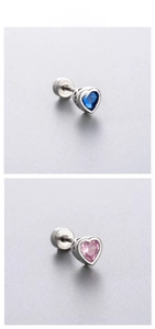 Detail showing heart-shaped zircon ear studs with secure screw-back flat design