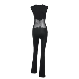 Detail view showing the sexy mesh patchwork on the waist of a black slim-fit jumpsuit