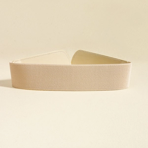 Detailed view of beige elastic wide waist belt with premium faux leather buckle detail