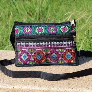 Ethnic crossbody bag with colorful geometric embroidery and dual zipper compartments
