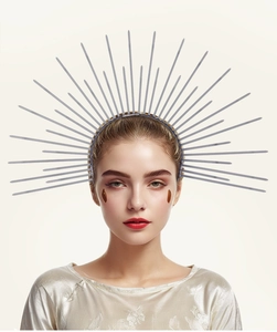 Close-up of a silver sunburst crown headband worn by a model for Halloween cosplay