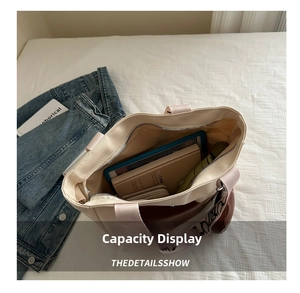 Top view showing the large interior capacity of the canvas tote bag with daily items