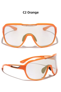 Detail of orange Y2K shield sunglasses showing the bridge and light gray gradient lens