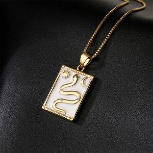 18K gold plated necklace with white enamel snake pendant and green zircon eyes