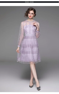 Detail of lavender lace dress with mesh long sleeves and pearl neck ornaments
