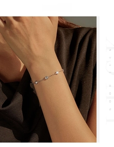 Detail of S925 sterling silver bubble chain bracelet with sparkling round-cut crystals