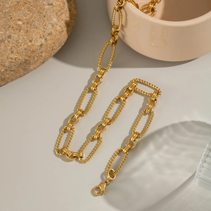 Close-up of 18K gold-plated stainless steel chain necklace with a lobster clasp