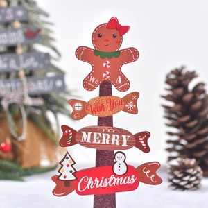 Miniature wooden Christmas tree tabletop decor with gingerbread man and candy signs