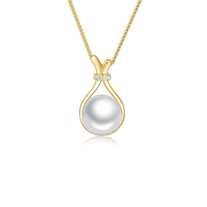 Detailed macro view of a gold lucky bag pendant with white pearl and pave zircon stones