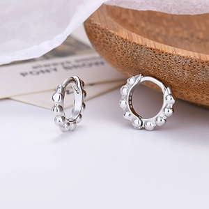 Detailed close-up of S925 sterling silver beaded hoop earrings with a polished finish
