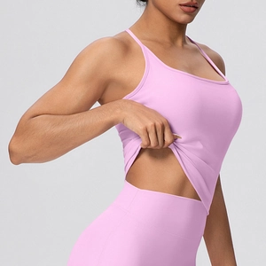 Detail shot of pink high-elastic yoga set with fine straps and high-waist sports leggings