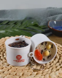 Close-up of realistic eight-treasure porridge food model keychain with bowl detail