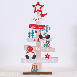 Close-up of wooden Christmas tree decor with festive figurines and holiday greetings