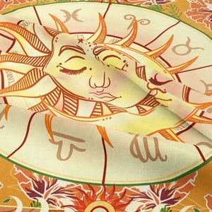 Detailed macro view of woven fabric texture with sun and zodiac symbols printed on tapestry