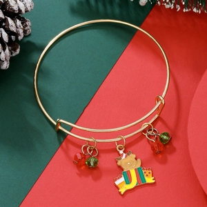Detailed view of adjustable gold Christmas bangle with elk pendants and festive charms